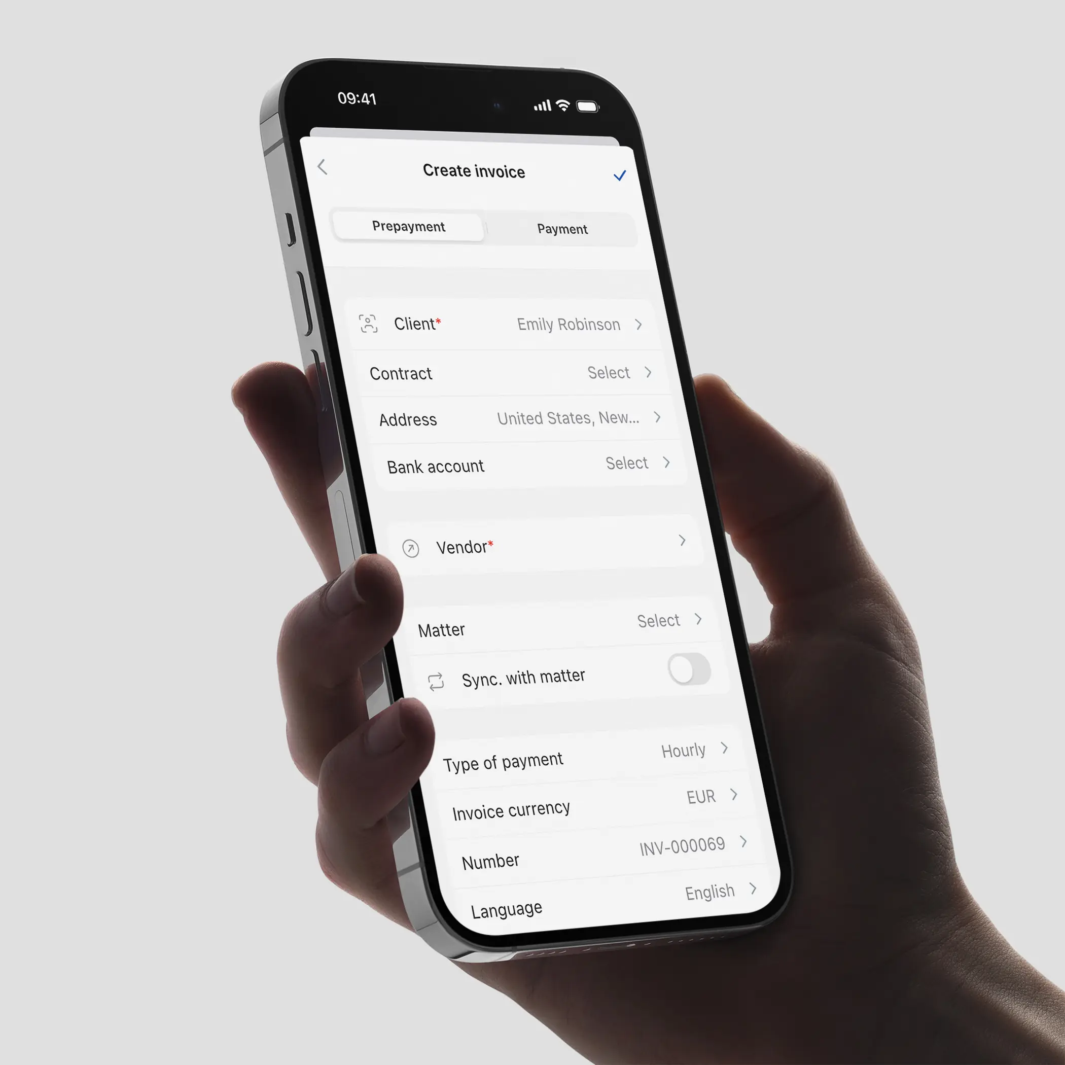 Hand holding an iPhone 15 Pro displaying the 'Create Invoice' page of the Jusnote Mobile Application with dropdown menus for client and payment details, showcasing the user interface designed by Smotrow Design